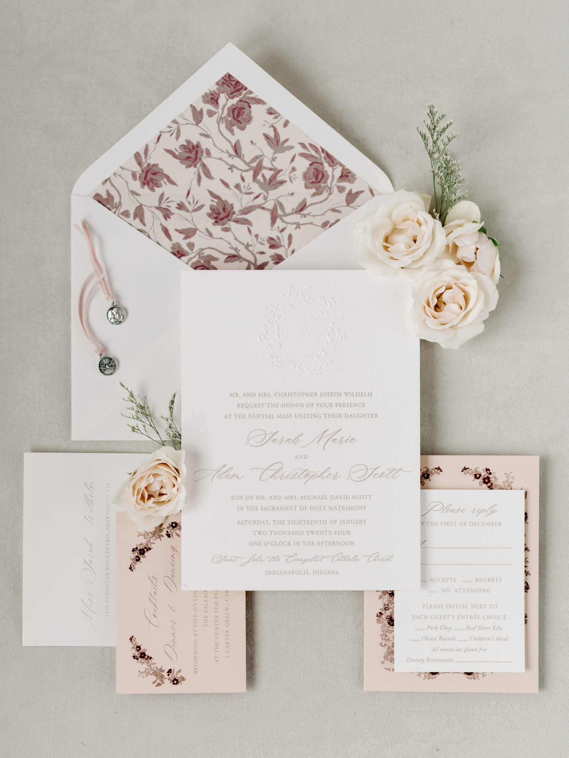 An invitation set in shades of blush and Burgundy 