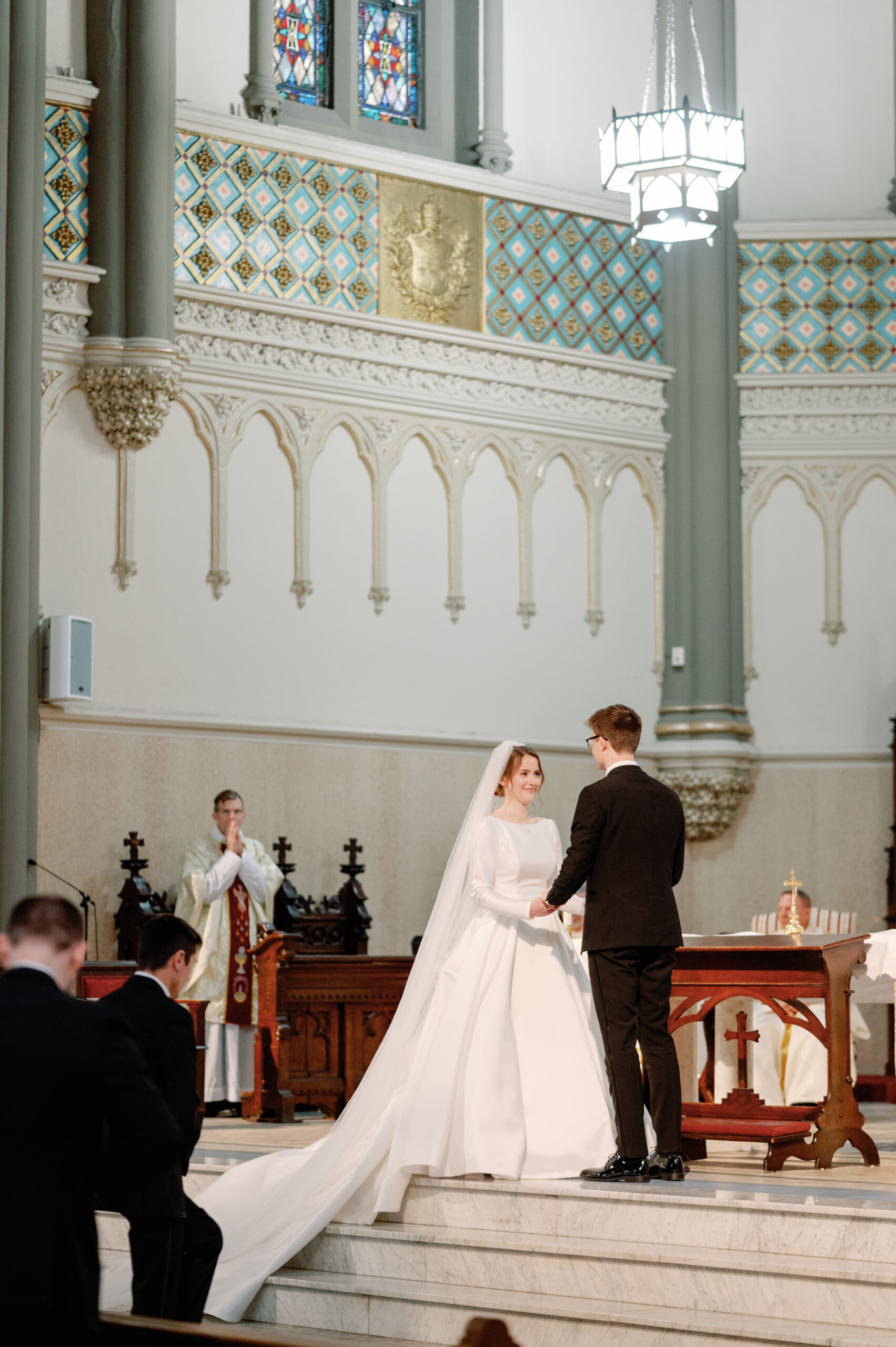 A bride and groom at the altar of St. John the Evangelist in Indianapolis